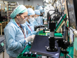 IMI production line technicians assembling electronics